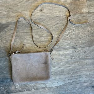 Tan shoulder purse with a long adjustable strap
